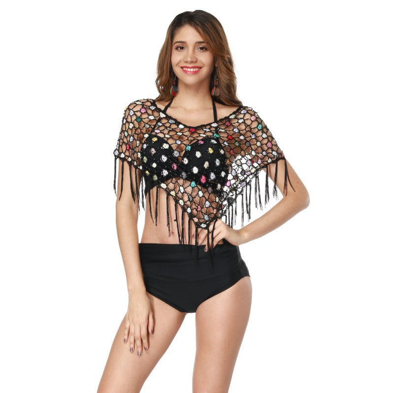 Women's crocheted beach poncho with colorful details and fringes