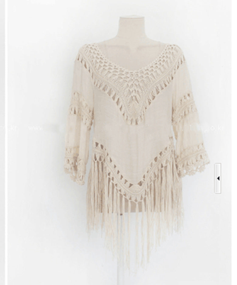 Women's crochet beach tunic with fringe decorations and elegant V-neck