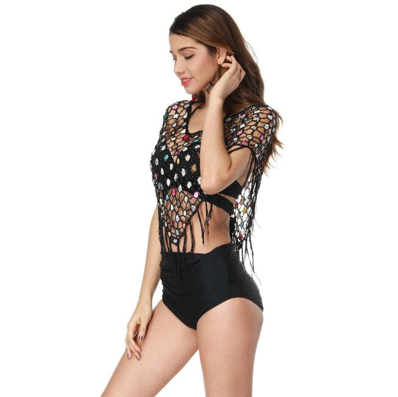 Women's crocheted beach poncho with colorful details and fringes