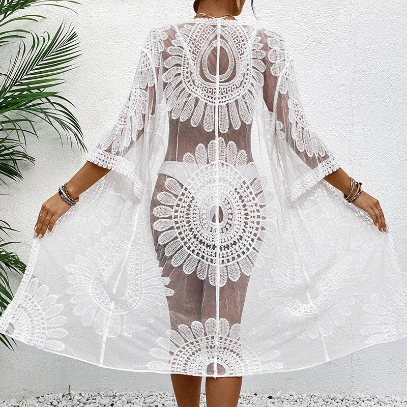 Women's transparent beach cover-up with elegant crochet pattern