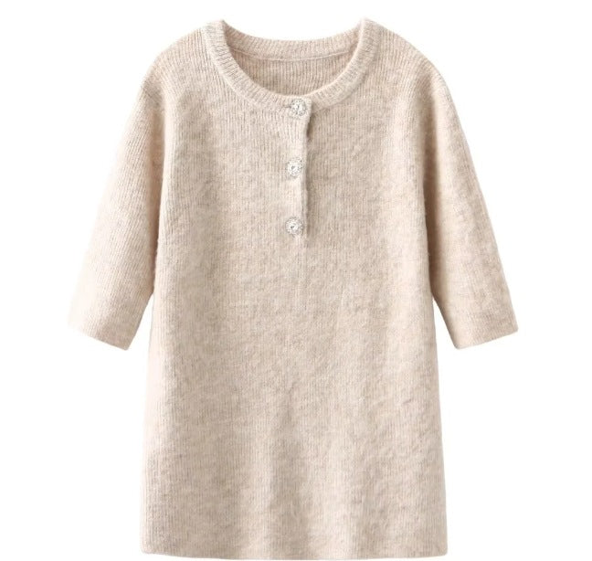 Women's knitted dress with half-length sleeves and decorative buttons