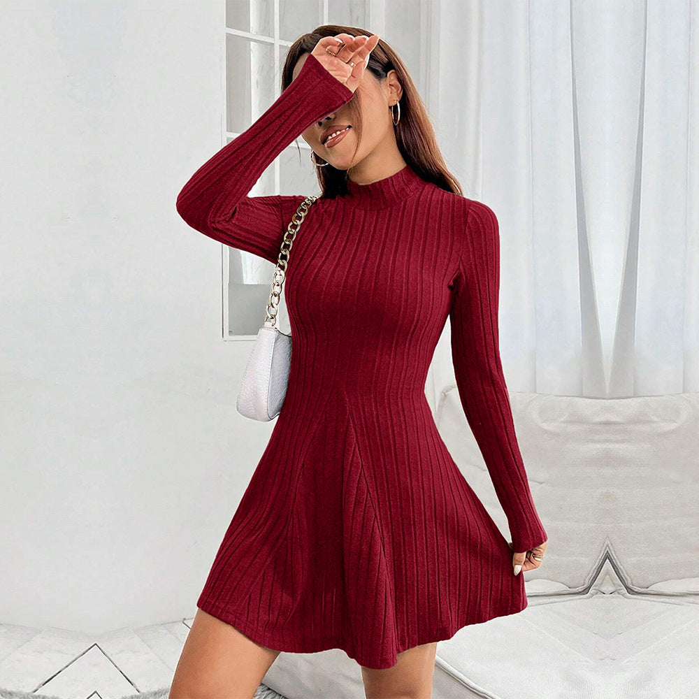 Women's knitted dress with high collar and flared hem