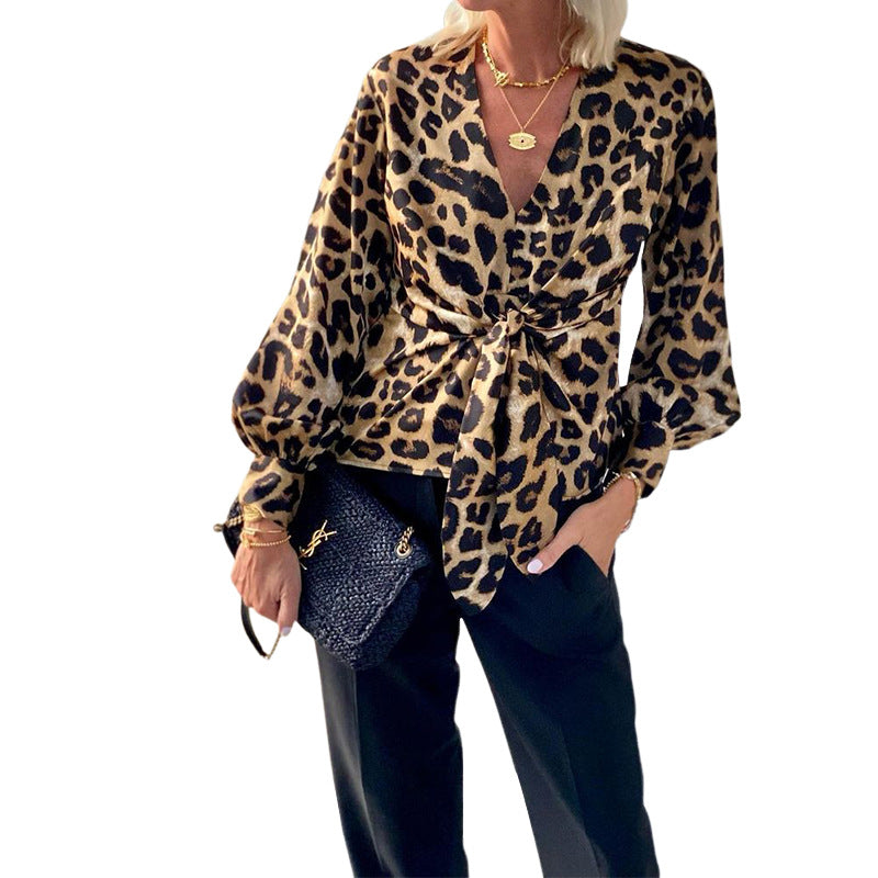 Women's blouse in modern animal print with deep V-neck and waist WW