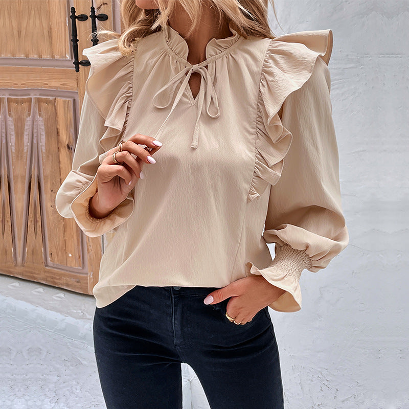 Women's blouse with elegant ruffle details and playful drawstring WW