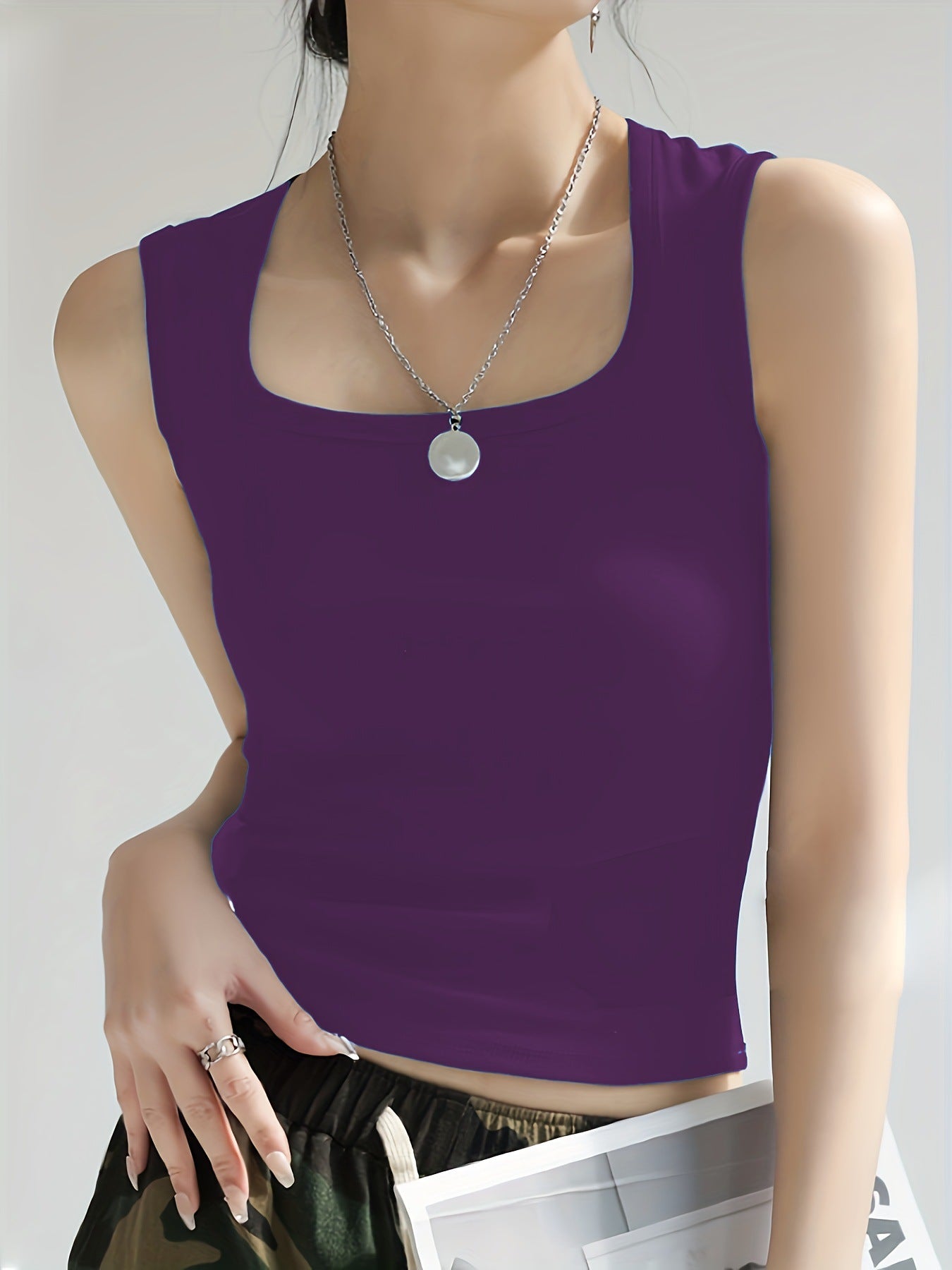 Women's sleeveless crop top made of elastic material with a figure-shaping cut WW