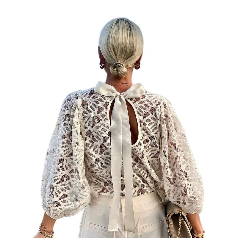 Women's blouse with elegant back neckline and playful tie belt WW