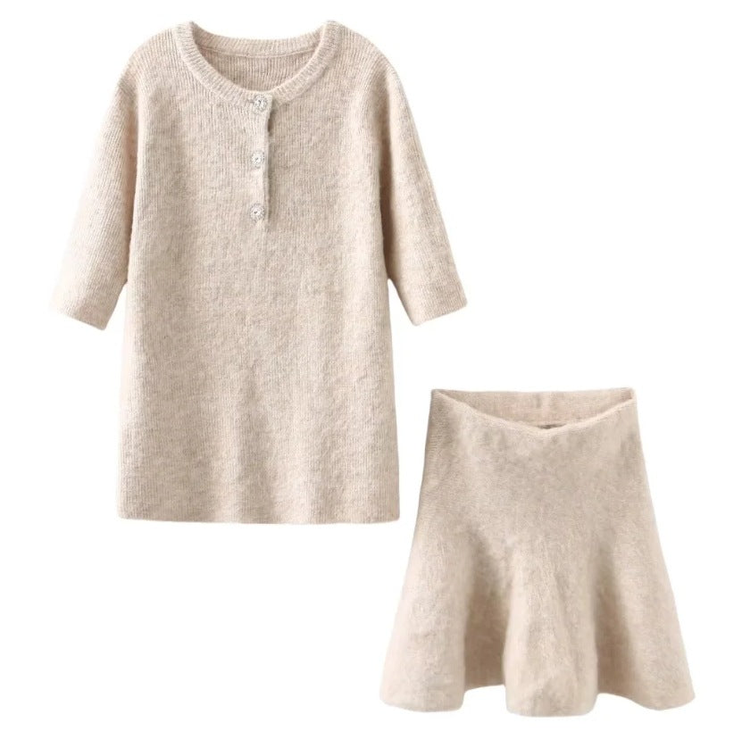 Women's knitted dress with half-length sleeves and decorative buttons