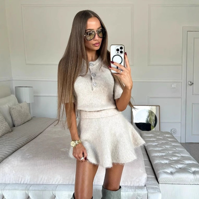 Women's knitted dress with half-length sleeves and decorative buttons