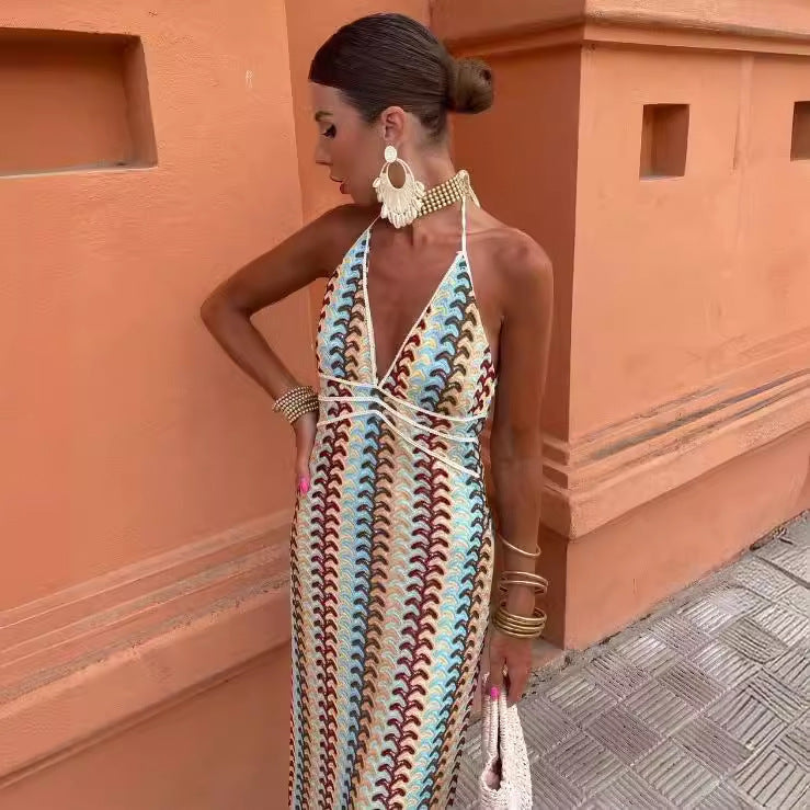Women's knitted dress with deep V-neck and sophisticated wave pattern