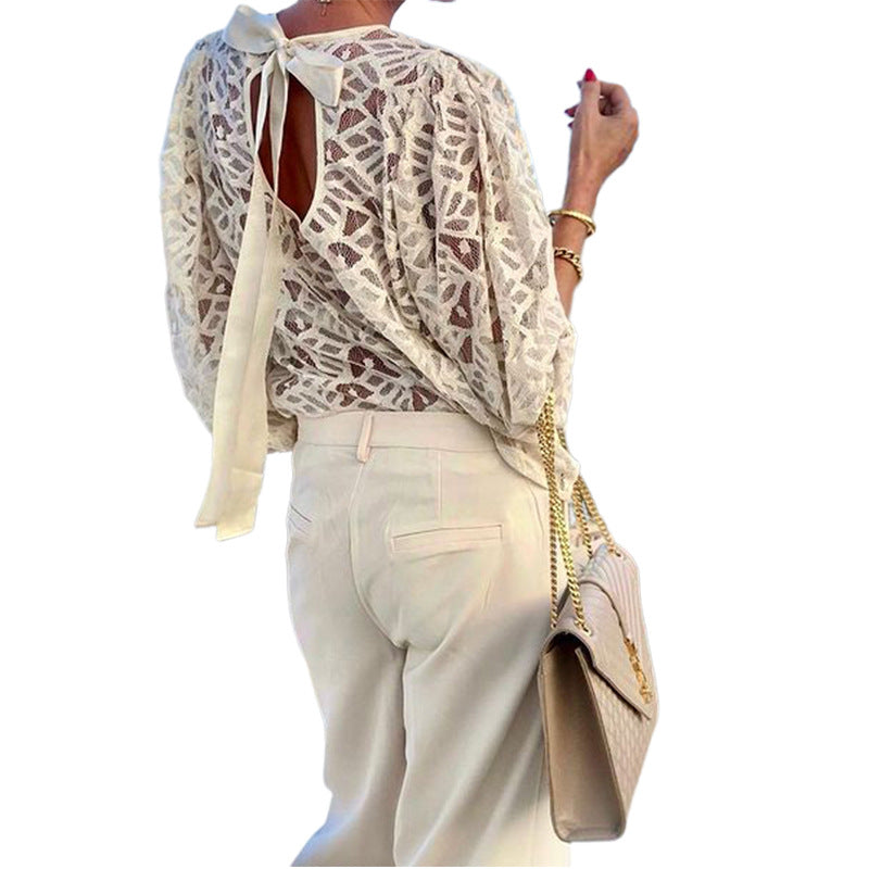 Women's blouse with elegant back neckline and playful tie belt WW