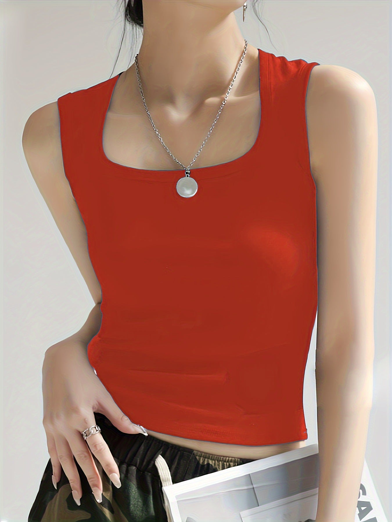 Women's sleeveless crop top made of elastic material with a figure-shaping cut WW