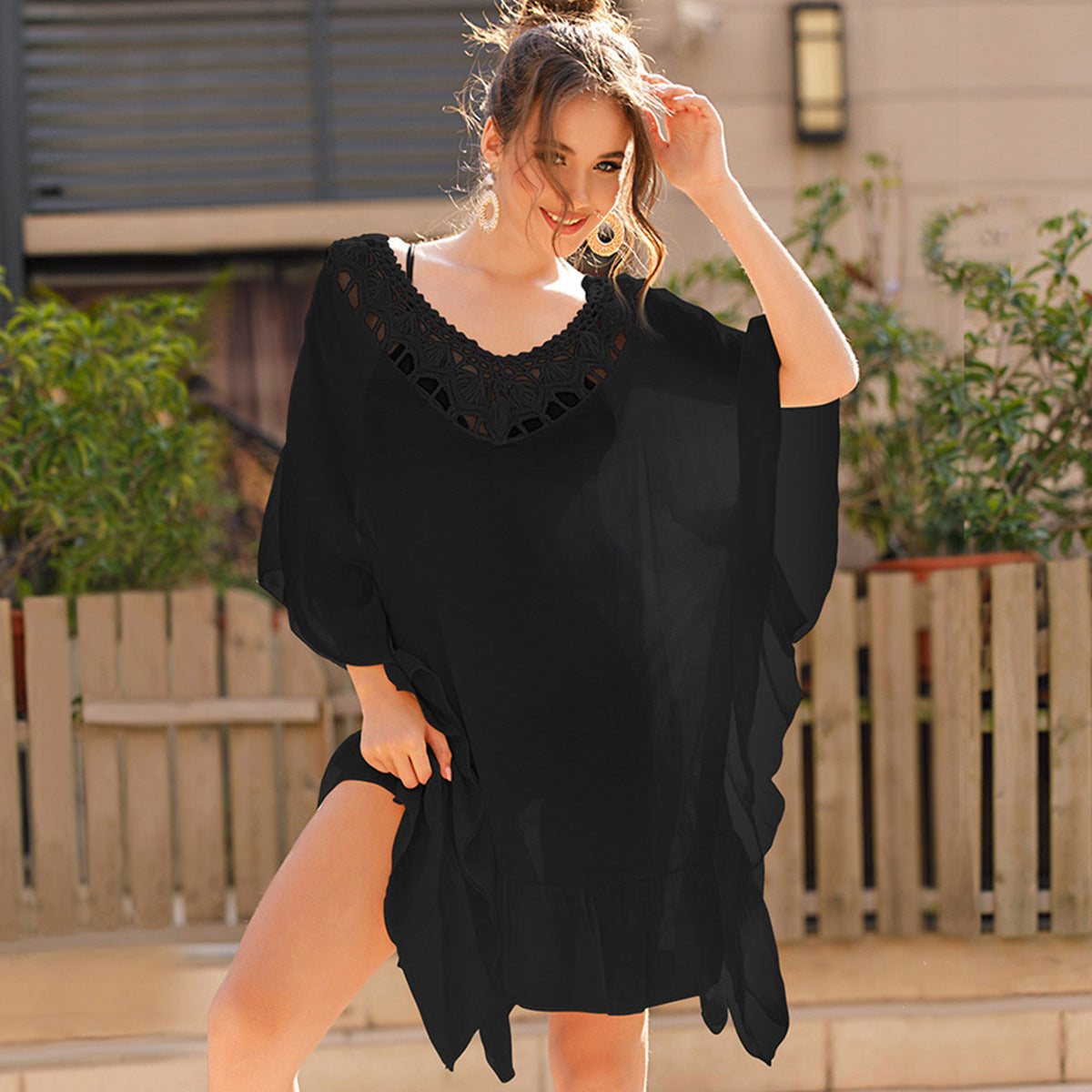 Women's beach kimono with an artistic openwork pattern and flowing cut