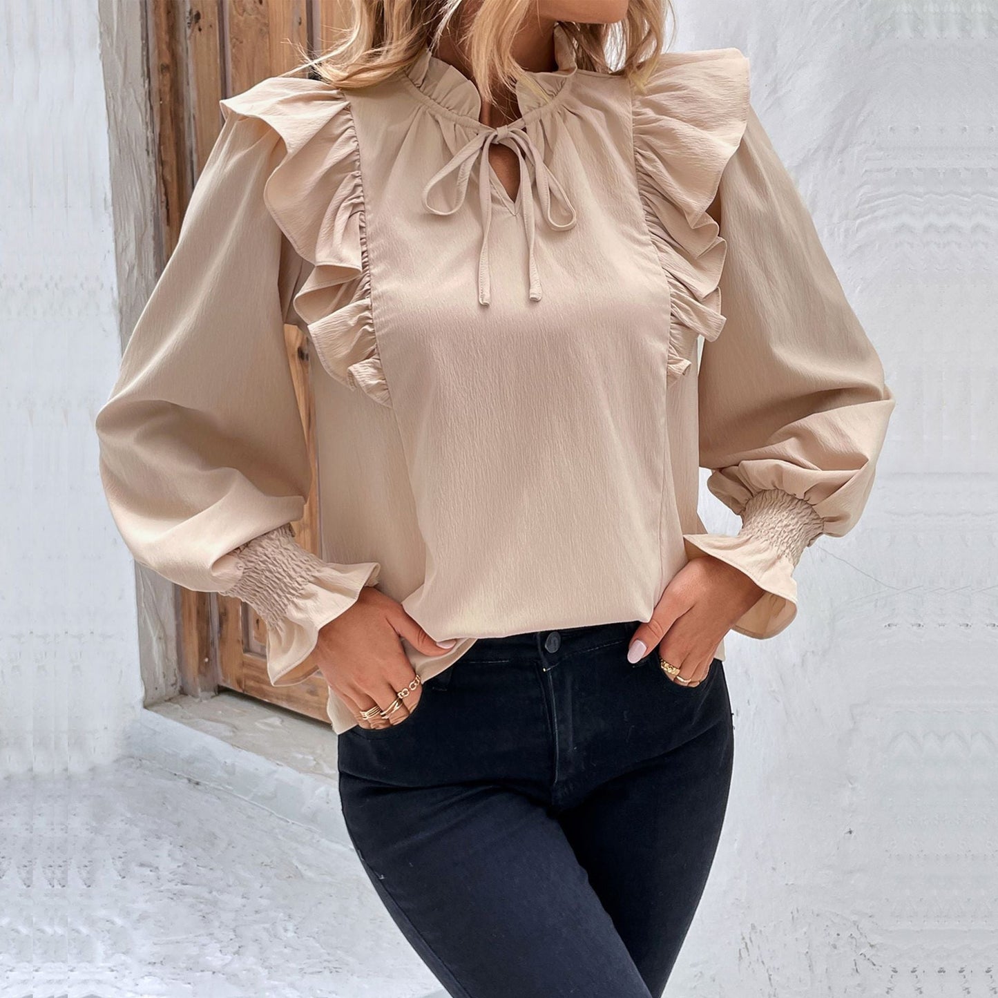 Women's blouse with elegant ruffle details and playful drawstring WW