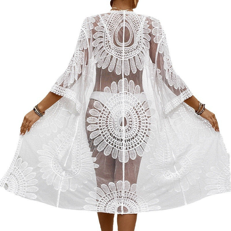 Women's transparent beach cover-up with elegant crochet pattern