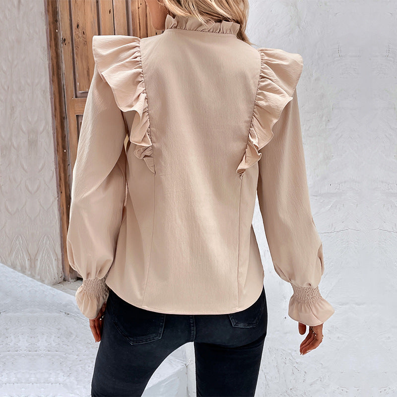 Women's blouse with elegant ruffle details and playful drawstring WW