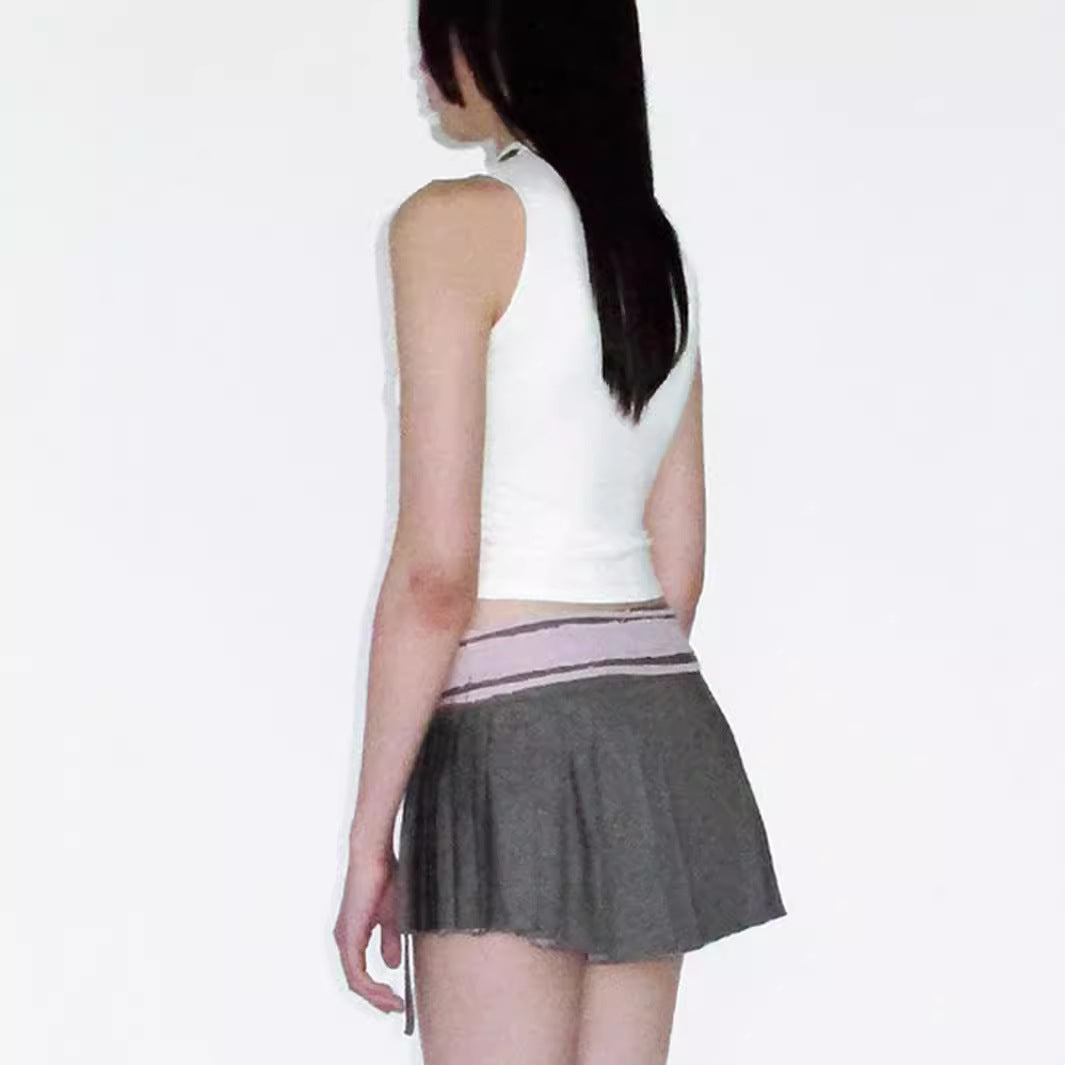 Women's sleeveless top with playful cable design and bow accents W&W