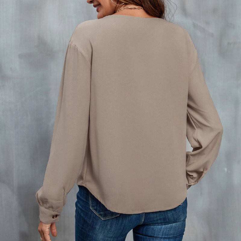 Women's blouse with asymmetric design and elegant button details WW