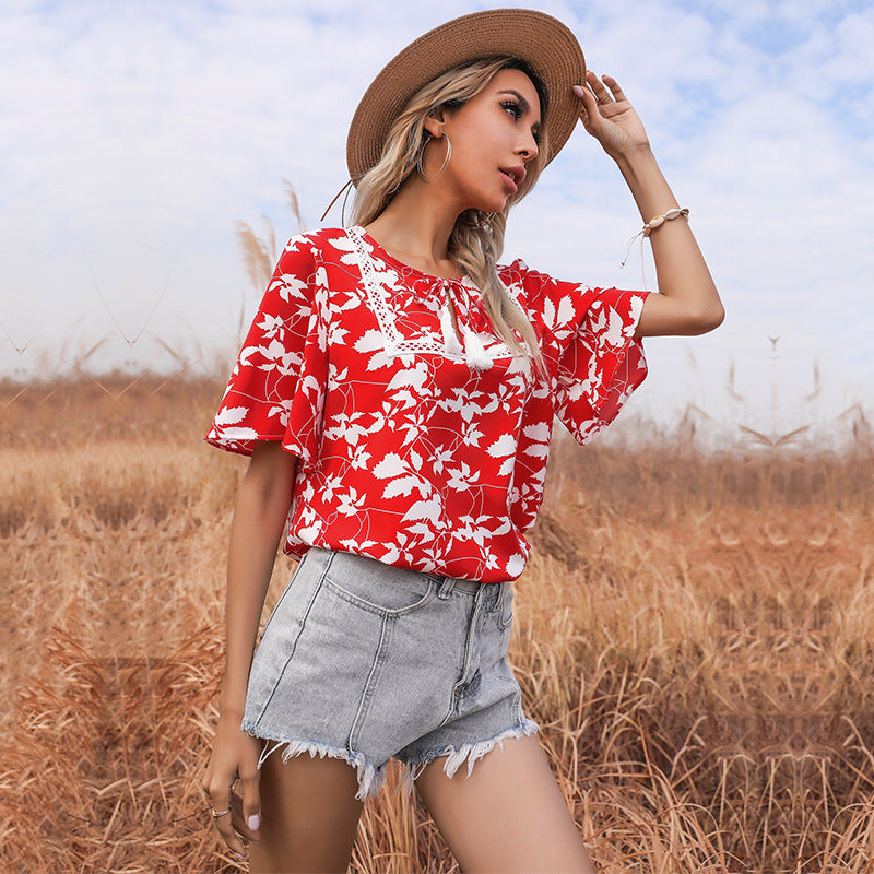Women's floral design top with voluminous sleeves and elegant V-neck WW