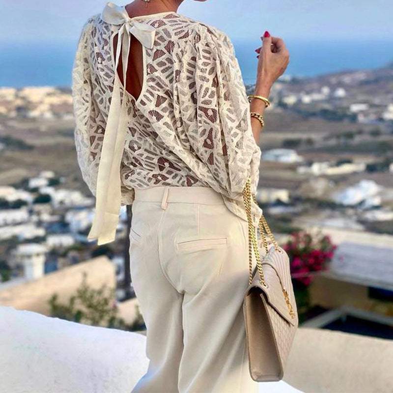 Women's blouse with elegant back neckline and playful tie belt WW