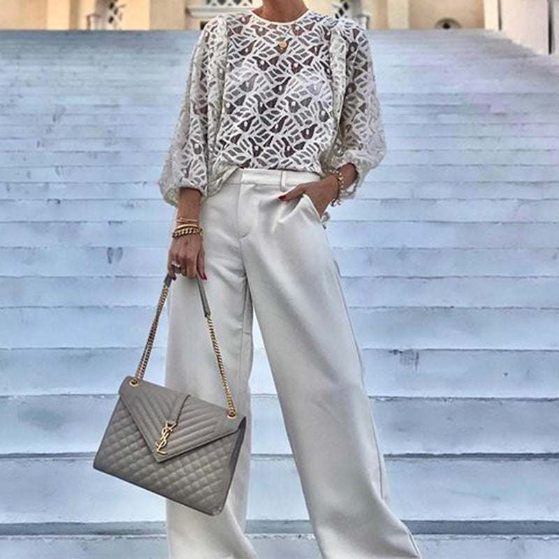 Women's blouse with elegant back neckline and playful tie belt WW