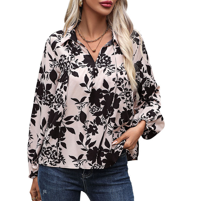 Women's blouse with elegant ruffle details and playful floral pattern WW