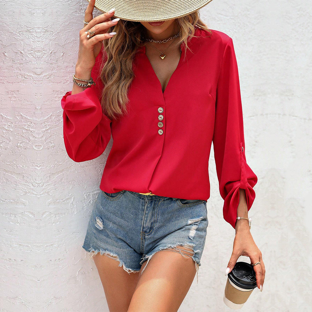 Women's blouse with elegant V-neck and sophisticated button details W&W