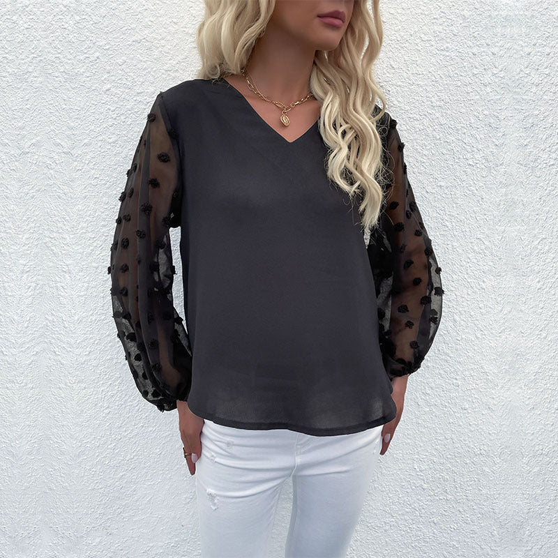 Women's blouse with elegant puff sleeves and structured outer material WW