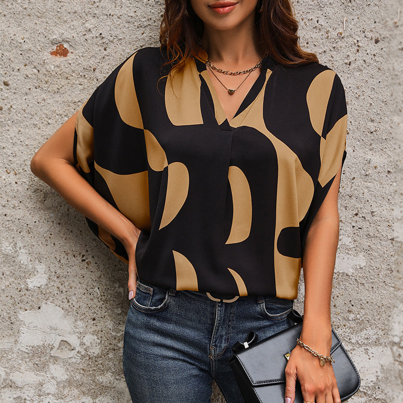 Women's blouse in a modern abstract design with V-neck and short sleeves WW