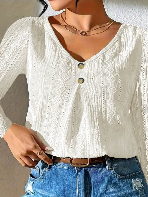 Women's blouse with decorative buttons and textured fabric WW