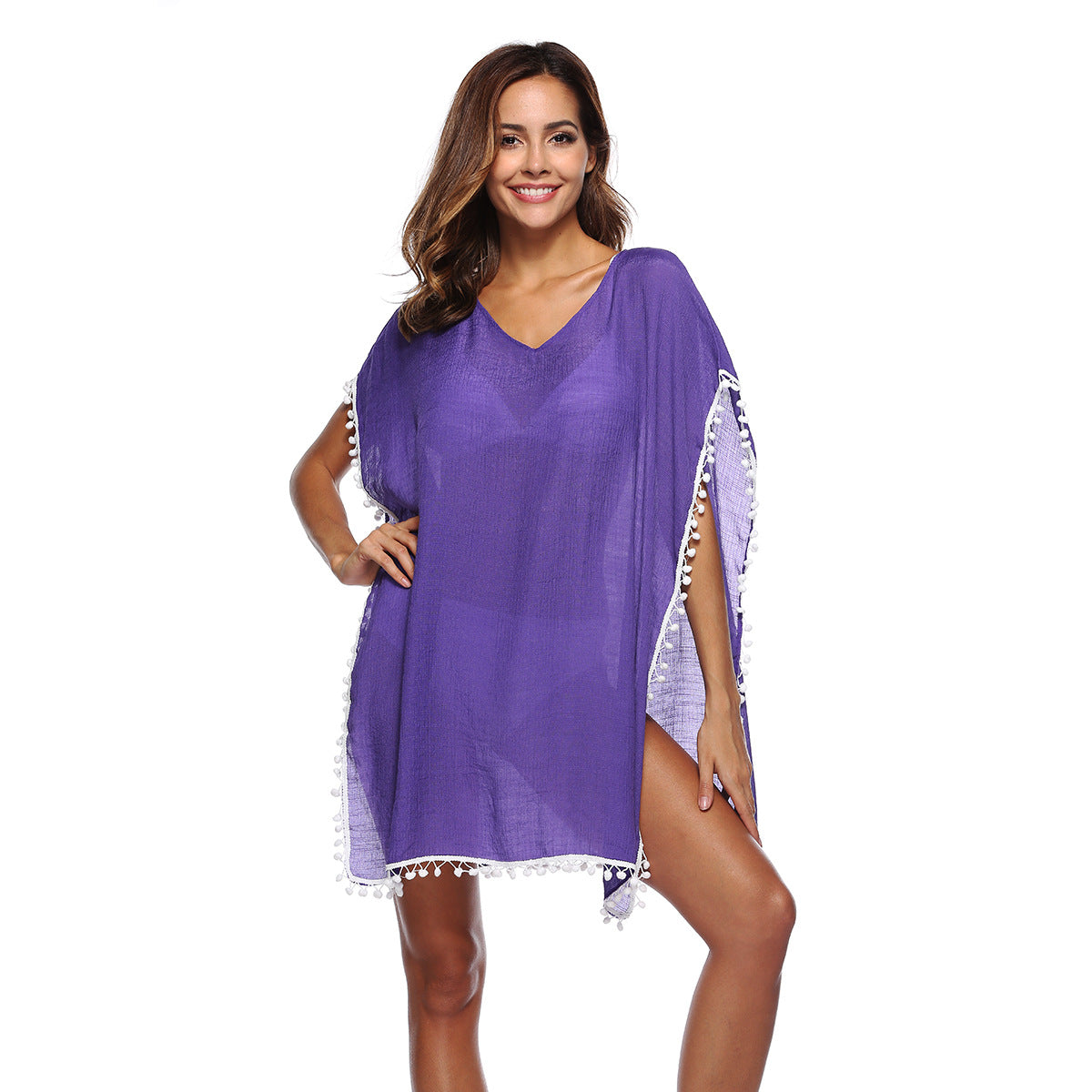 Women's beach poncho with tasteful fringes and a casual cut