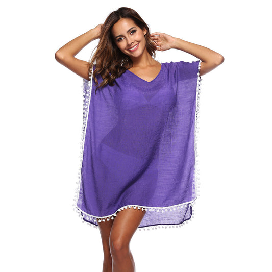Women's beach poncho with tasteful fringes and a casual cut