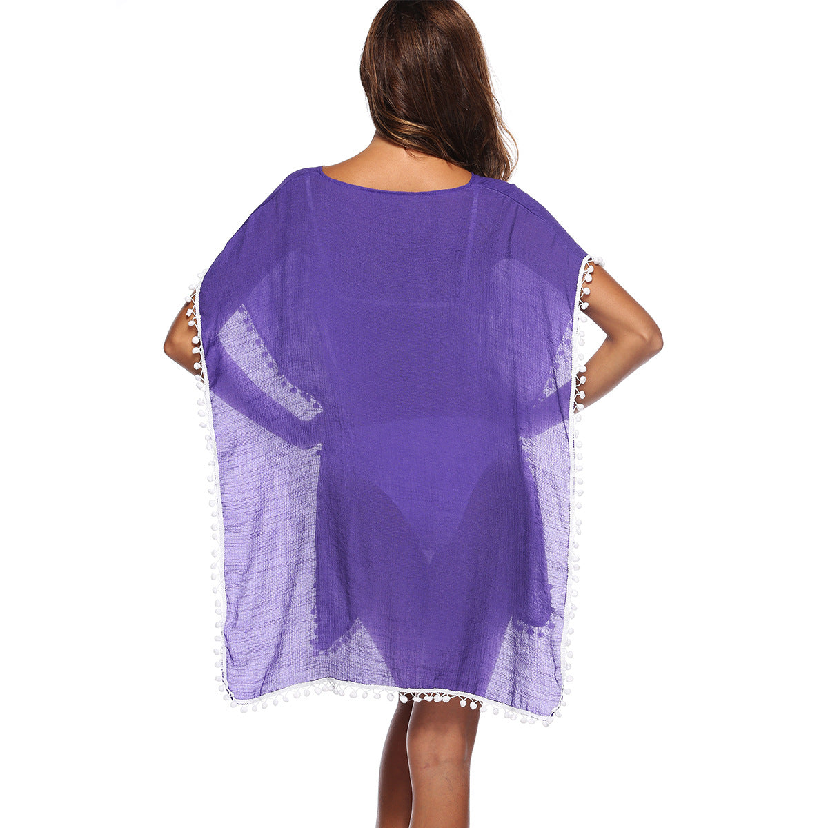 Women's beach poncho with tasteful fringes and a casual cut