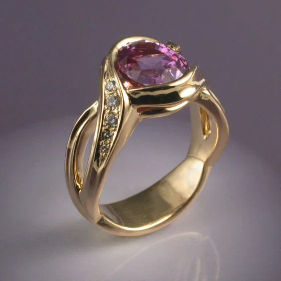 Gold ring with garnet crystal and zirconia