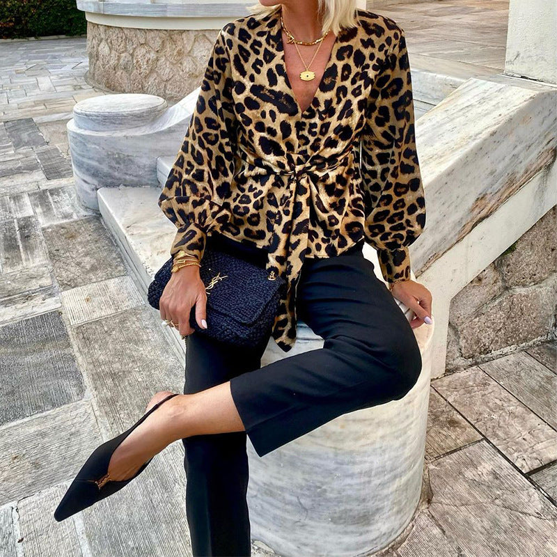 Women's blouse in modern animal print with deep V-neck and waist WW