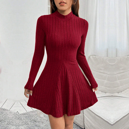 Women's knitted dress with high collar and flared hem
