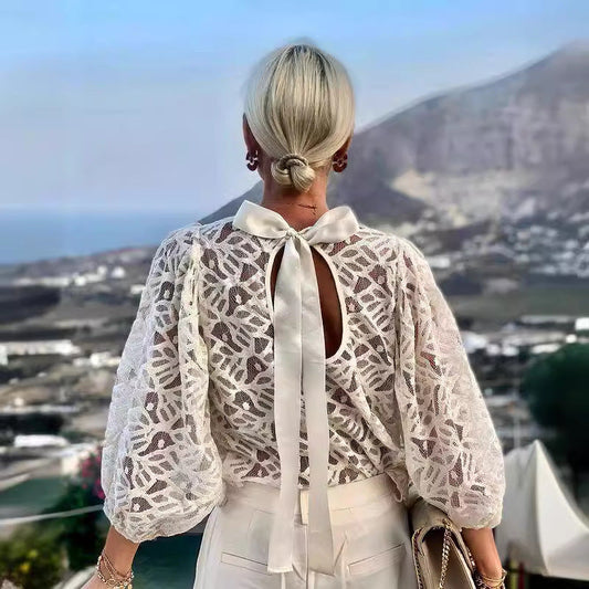 Women's blouse with elegant back neckline and playful tie belt WW