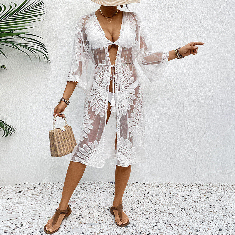 Women's transparent beach cover-up with elegant crochet pattern