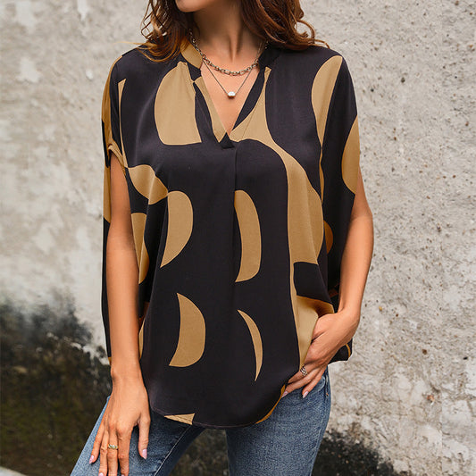 Women's blouse in a modern abstract design with V-neck and short sleeves WW