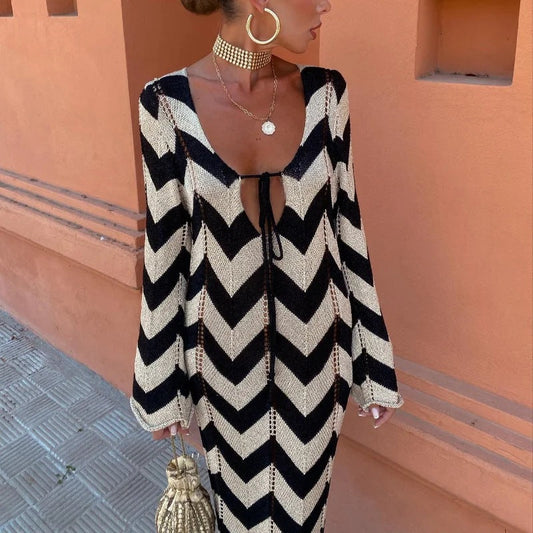 Women's knitted dress with chevron pattern and deep V-neck