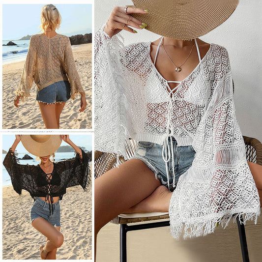 Women's crochet wrap with wide sleeves and frayed accents