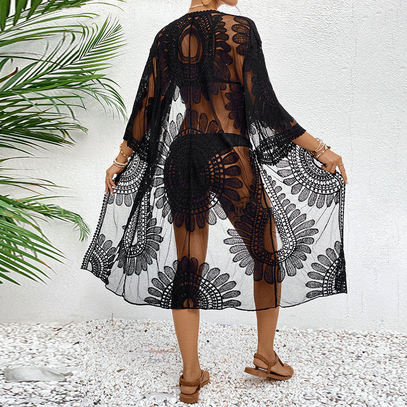 Women's transparent beach cover-up with elegant crochet pattern