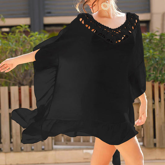 Women's beach kimono with an artistic openwork pattern and flowing cut