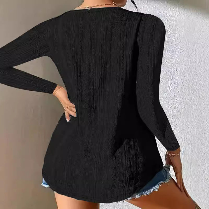 Women's blouse with decorative buttons and textured fabric WW