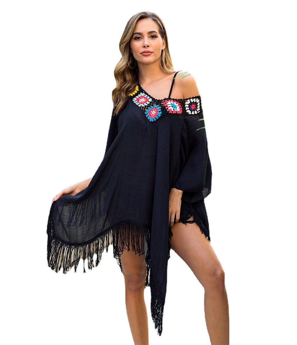 Women's beach poncho with artistic fringes and colorful appliqués