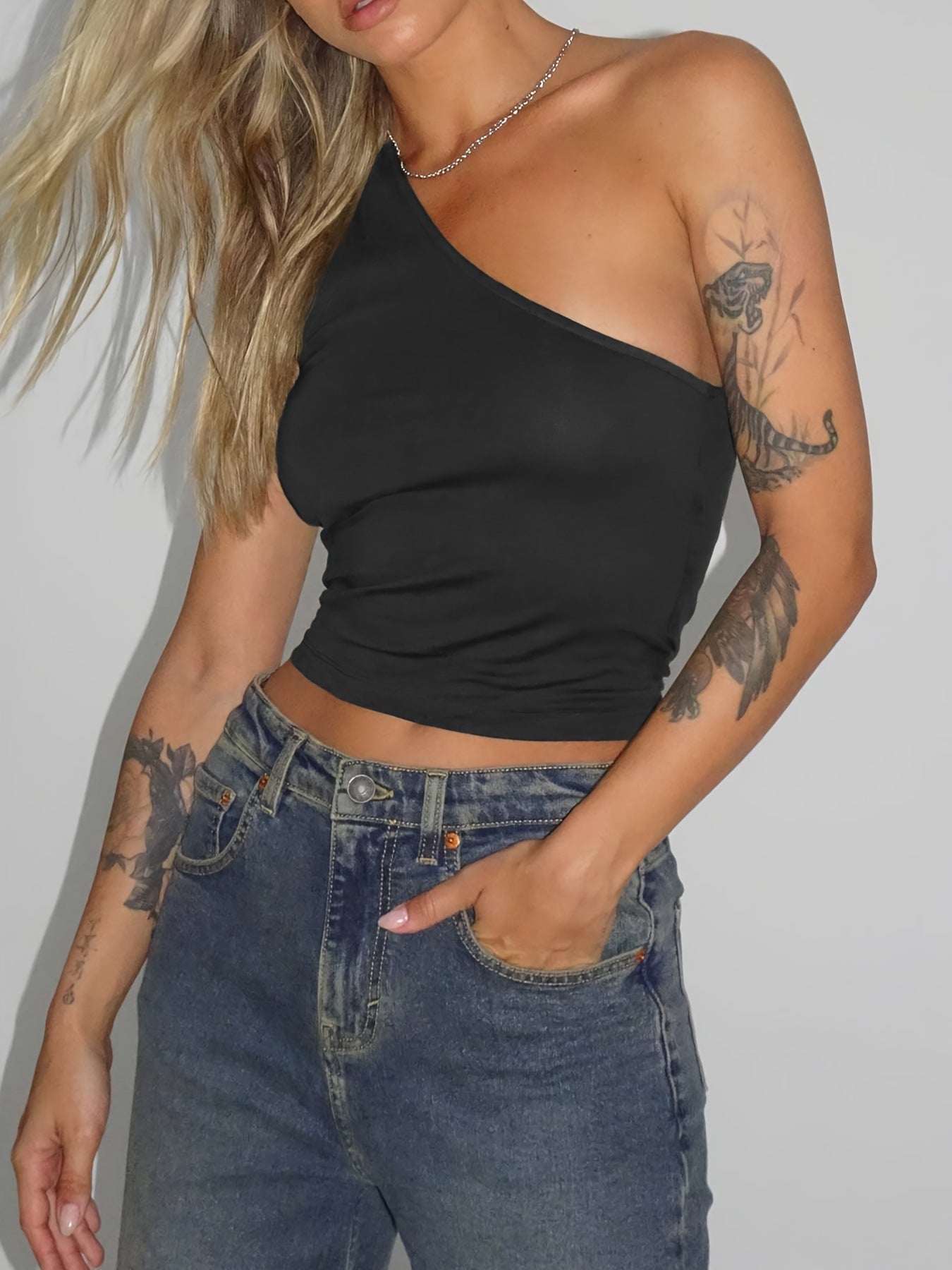 Women's asymmetric crop top made of stretch fabric with a slim fit WW