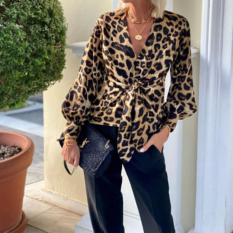Women's blouse in modern animal print with deep V-neck and waist WW