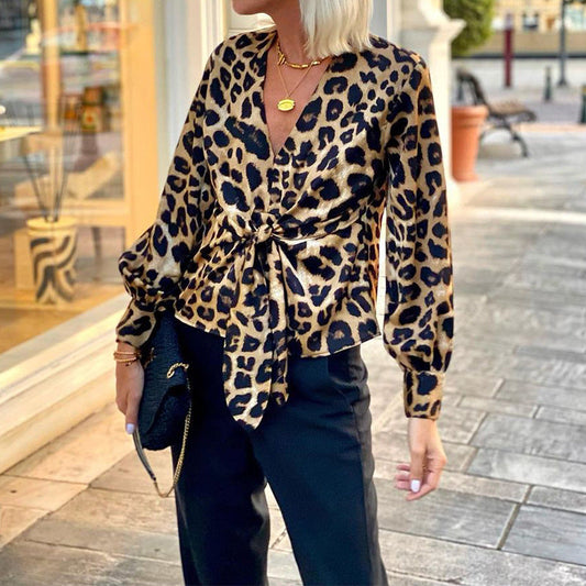 Women's blouse in modern animal print with deep V-neck and waist WW