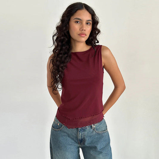 Women's sleeveless top with elegant transparent hem and figure-shaping cut W&W
