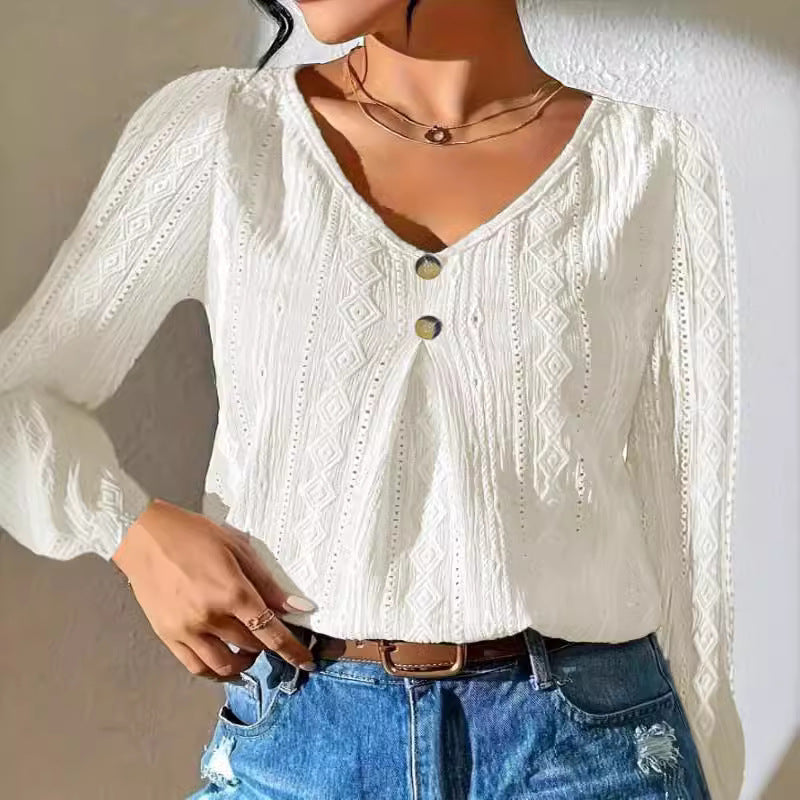 Women's blouse with decorative buttons and textured fabric WW