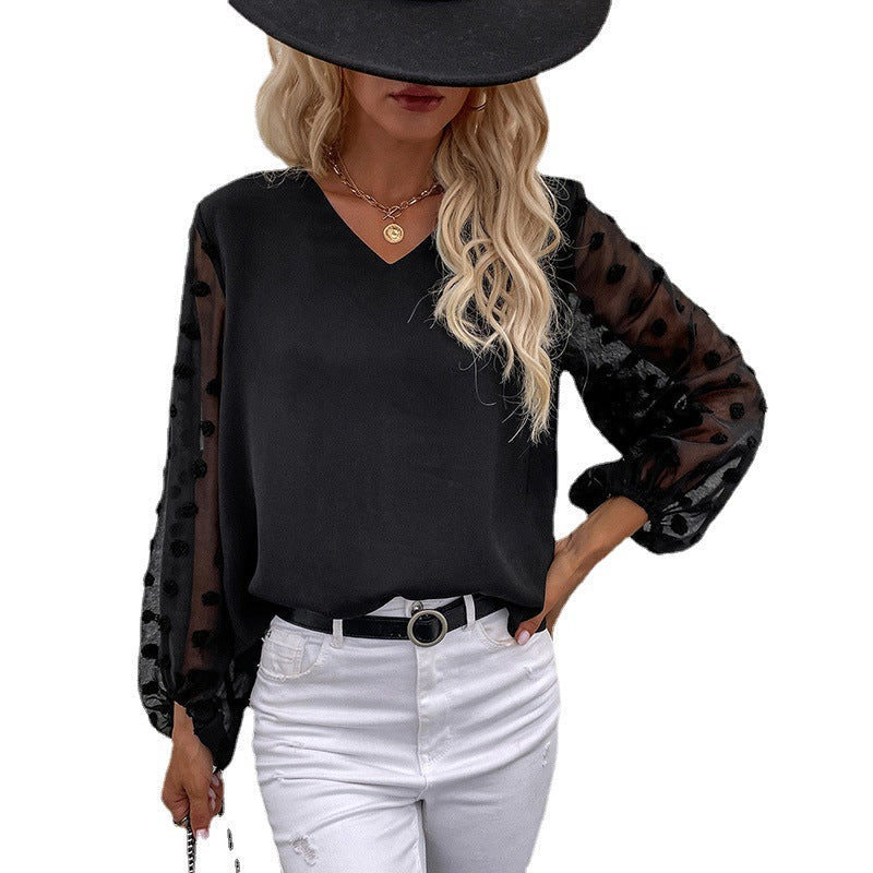 Women's blouse with elegant puff sleeves and structured outer material WW
